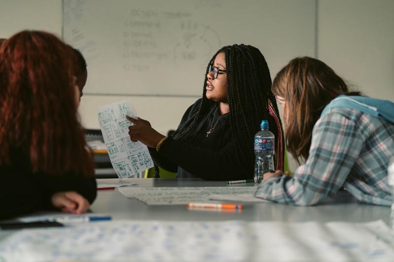 Generation Glas 2024 UCD Design Thinking for events showing three youth participants taking part in discussion